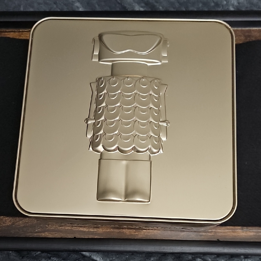 Paco Rabanne Gold Embossed Metal Plaque